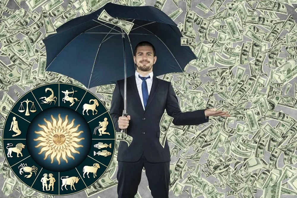 Мужчина с зонтом возле зодиакального круга и денежных купюр